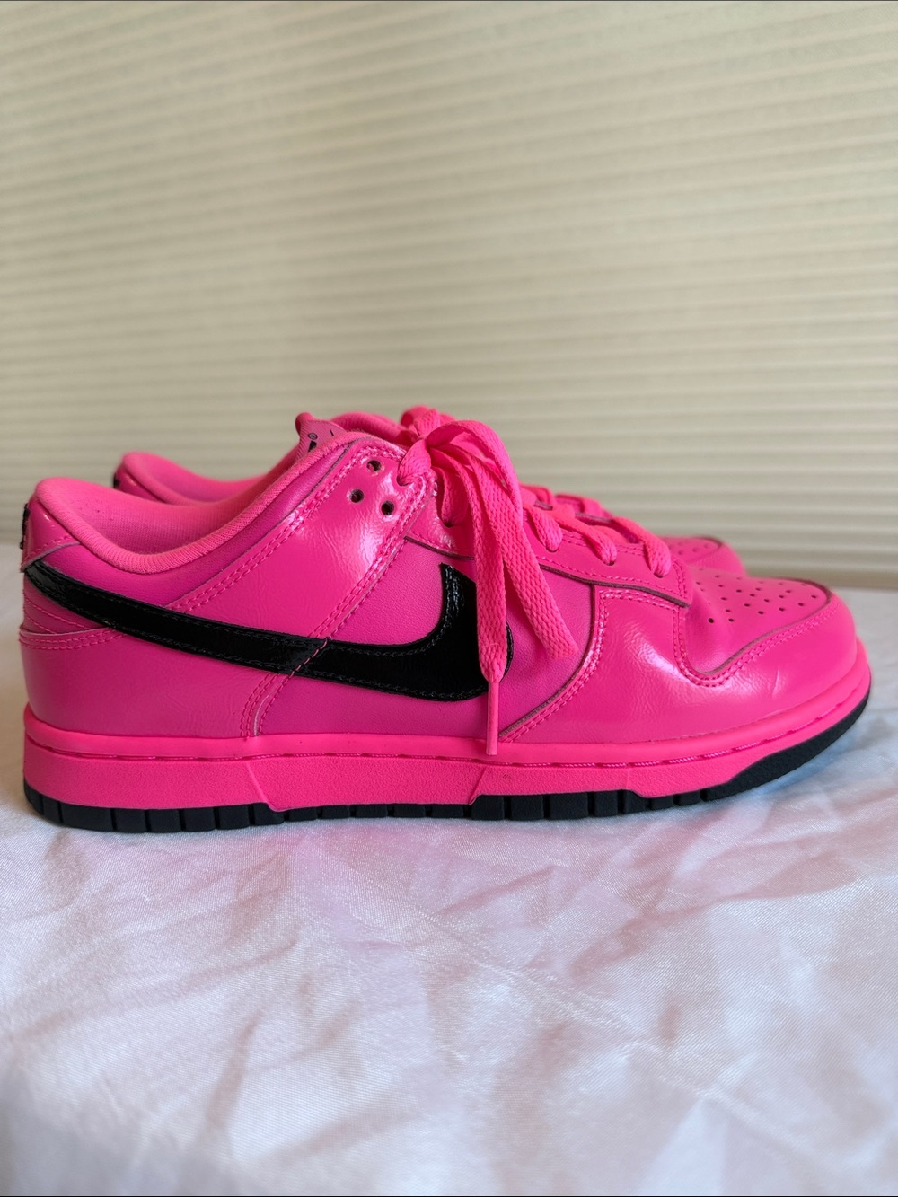 Nike Women’s Pink Low-Top Sneakers with Black Swoosh